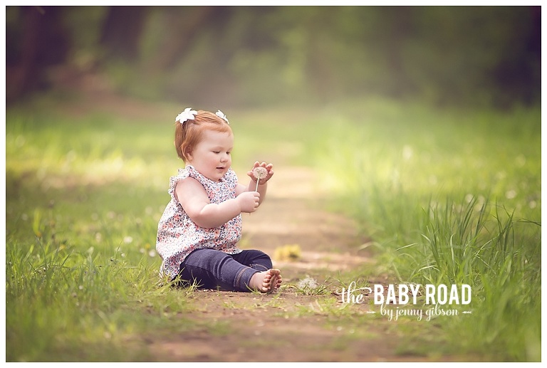 little girl playing with dandelion